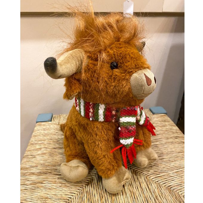 Highland Cow Stuffie with a red and green scarf is available at Quilted Cabin Home Decor.