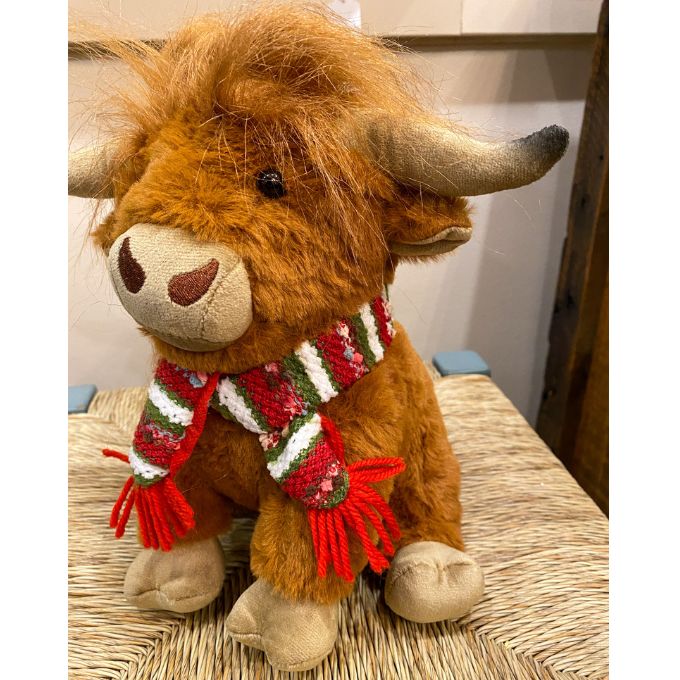 Highland Cow Stuffie with a red and green scarf is available at Quilted Cabin Home Decor.