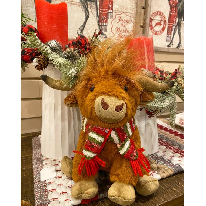 Highland Cow Stuffie with a red and green scarf is available at Quilted Cabin Home Decor.