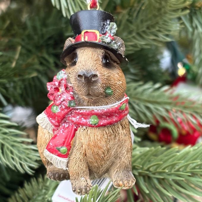 Happy Capybara with a top hat and a scarf ornament available at Rustic Ranch Furniture in Airdrie