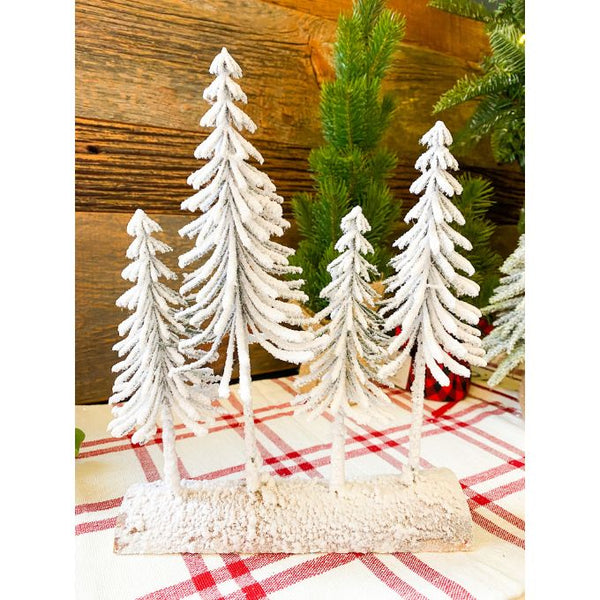 The Snowy Pine Forest on a Log is four very snowy looking trees on a half log. Available at Quilted Cabin Home Decor.