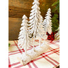 The Snowy Pine Forest on a Log is four very snowy looking trees on a half log. Available at Quilted Cabin Home Decor.