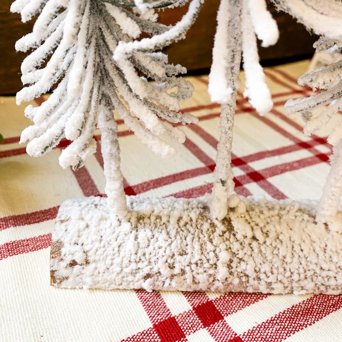 The Snowy Pine Forest on a Log is four very snowy looking trees on a half log. Available at Quilted Cabin Home Decor.