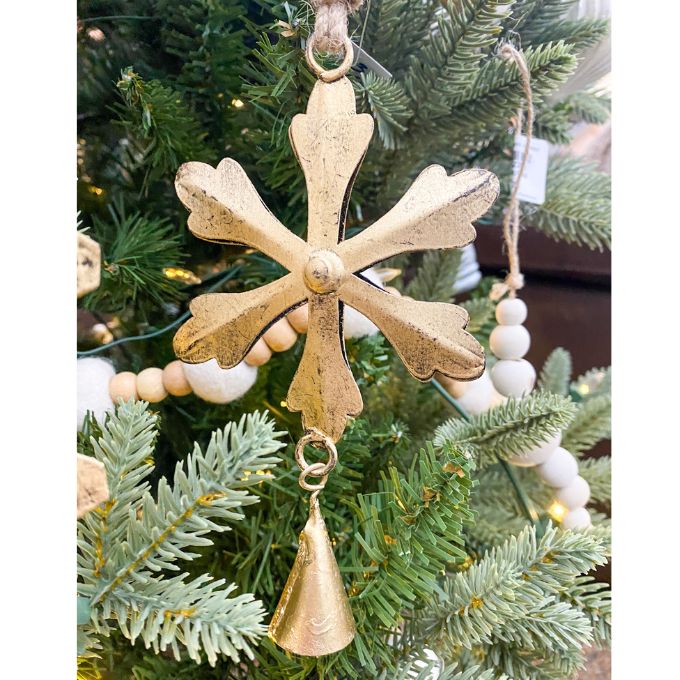 Decorative gold snowflake ornament with a bell hanging on a Christmas tree. Vintage Gold Snowflake Ornaments - Set of Three available at Quilted Cabin  Home Decor.