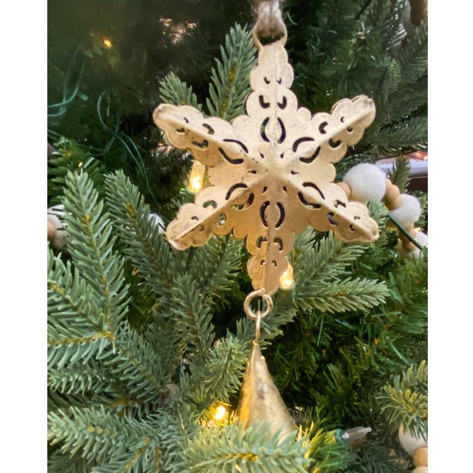 Decorative snowflake ornament hanging on a Christmas tree. Vintage Gold Snowflake Ornaments - Set of Three available at Quilted Cabin  Home Decor.
