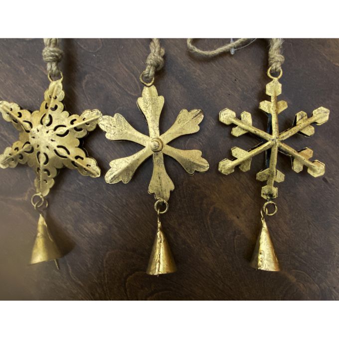 Three gold snowflake-shaped ornaments with bells on a dark brown background.  Vintage Gold Snowflake Ornaments - Set of Three available at Quilted Cabin  Home Decor.