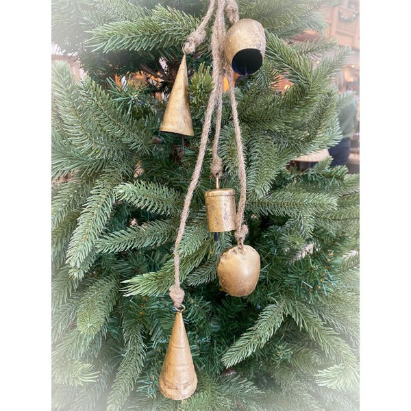 Decorative gold bell ornaments hanging on a Christmas tree. Mixed Gold Bells Hanger available at Quilted Cabin Home Decor.