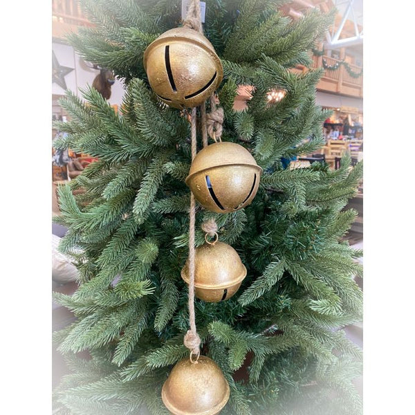 Gold jingle bells hanging on a Christmas tree. Round Gold Bells Hanger Hanger available at Quilted Cabin Home Decor.