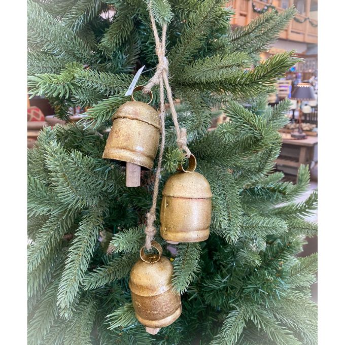 Decorative gold bells hanging on a Christmas tree. Three Gold Clapper Bell Hanger available at Quilted Cabin Home Decor.