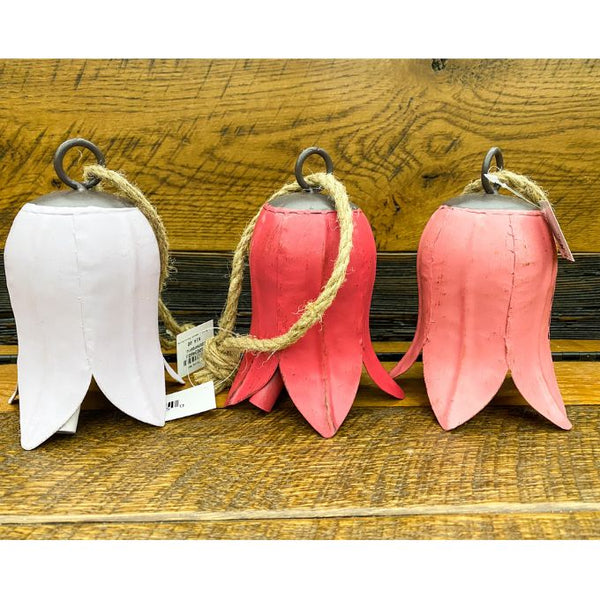 Three decorative tulip bells in white, red, and pink on a wooden surface. Tulip Bells - Three Colours available at Quilted Cabin Home Decor.