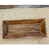 Wooden tray on a textured beige surface.  Reclaimed Wooden Trays come in three sizes and are available at Quilted Cabin Home Decor