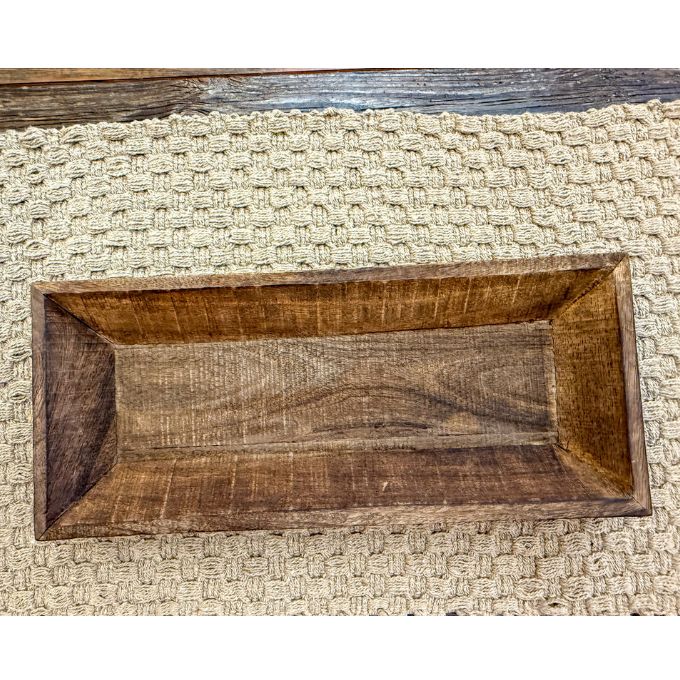Wooden tray on a textured beige surface.  Reclaimed Wooden Trays come in three sizes and are available at Quilted Cabin Home Decor