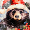 image of a Bear wearing a Santa hat with Christmas decorations in the background. Christmas Bear Round Wall Hanger available at Quilted Cabin Home Decor.