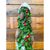Decorative Christmas tree figurine with green leaves, red berries, and pinecones against a wooden background. Pine Christmas Tree Figurine available at Quilted Cabin Home Decor.