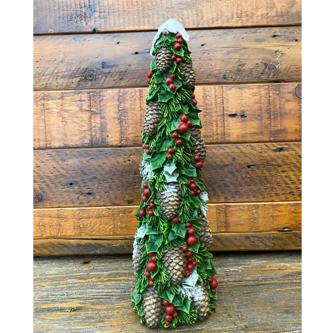 Decorative Christmas tree-shaped candle with pinecones and berries against a wooden background. Pine Christmas Tree Figurine available at Quilted Cabin Home Decor.