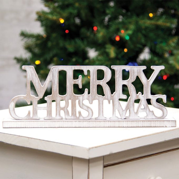 A distressed white wood Merry Christmas sign that will easily sit on your shelf or as part of a Christmas display. Available at Quilted Cabin Home Decor.