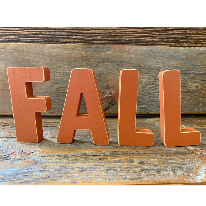 Orange wooden letters that spell FALL are available at Quilted Cabin Home Decor.