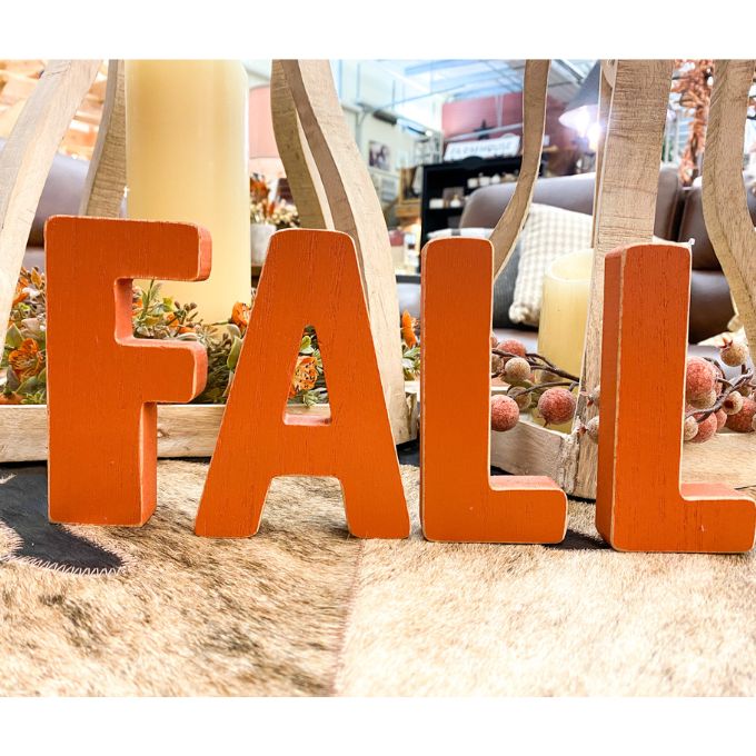 Orange wooden letters that spell FALL are available at Quilted Cabin Home Decor.