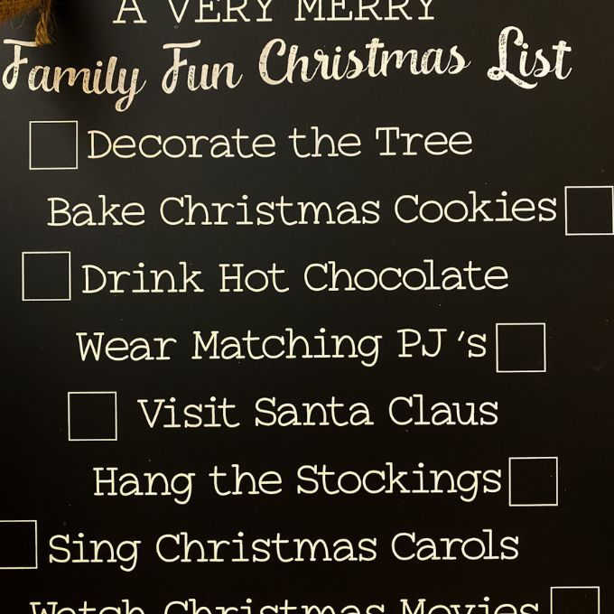 Family Fun Christmas Metal Sign available at Quilted Cabin Home Decor. The sign lists different Christmas activities and has christmas themed magnets .