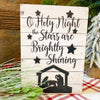 Oh Holy Night Nativity Sign is a white planked block sign with black printing and nativity cutout. It is available from Quilted Cabin Home Decor.