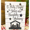 Oh Holy Night Nativity Sign is a white planked block sign with black printing and nativity cutout. It is available from Quilted Cabin Home Decor.