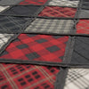 Close-up of a quilt with red, black, and gray plaid patterns. Lumberjack King Quilt Set available at Quilted Cabin Home Decor.