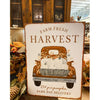 A metal fall decor sign that says Farm Fresh Harvest. An orange vintage truck is filled with pumpkins. Available at Quilted Cabin Home Decor.