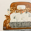 A metal fall decor sign that says Farm Fresh Harvest. An orange vintage truck is filled with pumpkins. Available at Quilted Cabin Home Decor.