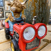 Highland Cow Tractor Solar Figurine available at Quilted Cabin Home Decor.