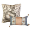 Decorative pillow with rabbit illustration and another with floral pattern on a white background. Peach Rose Toss Pillows - Set of Two available at Quilted Cabin Home Decor.