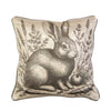 Decorative pillow with a rabbit illustration and nature elements on a beige background. Peach Rose Toss Pillows - Set of Two available at Quilted Cabin Home Decor.