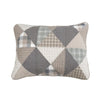 Patchwork pillow with geometric pattern on a white background. Smoky Star Queen Quilt Set available at Quilted Cabin Home Decor.