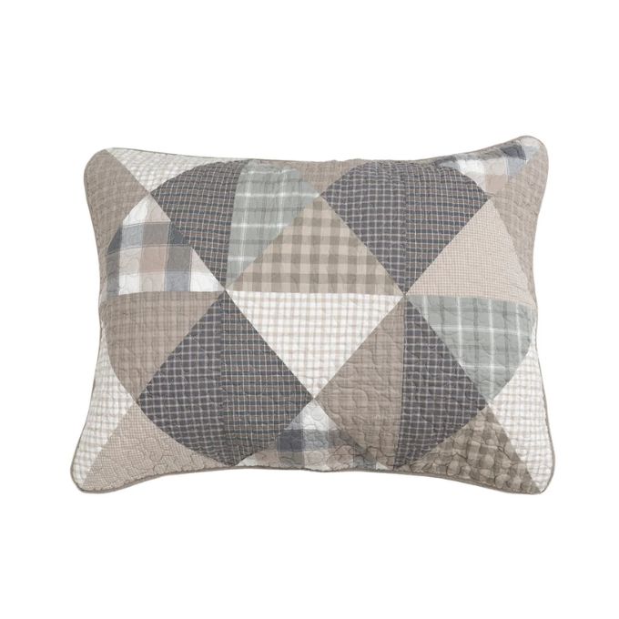 Patchwork pillow with geometric pattern on a white background. Smoky Star Queen Quilt Set available at Quilted Cabin Home Decor.