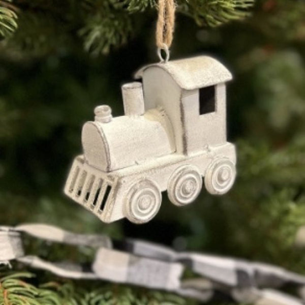 A white wash metal christmas train ornament available at Quilted Cabin Home Decor.