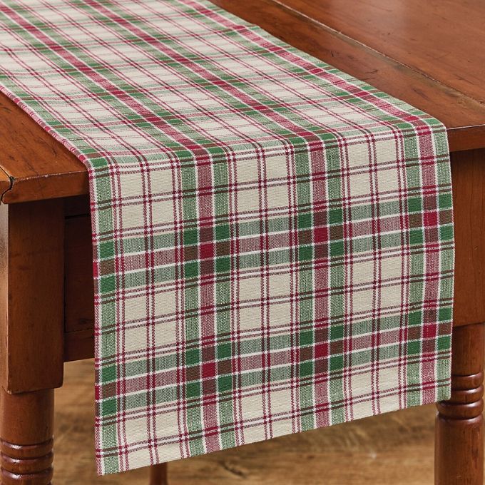 Village Christmas Plaid Table Runners - Two Sizes is a red and green plaid woven table runner. Available at Quilted Cabin Home Decor.