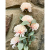 Pink Artificial flowers arranged against a stone wall. Amaranth Floral Stems - Three Colours available at Quilted Cabin Home Decor.