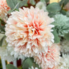 Close-up of a soft pink flower with green leaves in the background. Amaranth Floral Stems - Three Colours available at Quilted Cabin Home Decor.