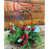 Decorative floral orb with red berries and greenery on a wooden background. Berry and Cedar Dripping Floral Orbs - Two Styles available at Quilted Cabin Home Decor.