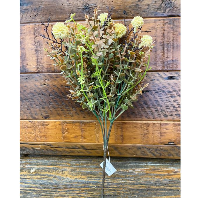 Bouquet of artificial flowers on a wooden surface. Cream Pincushion Floral Spray available at Quilted Cabin Home Decor.