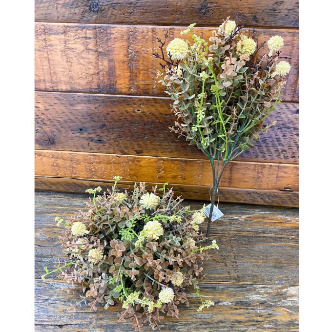 Artificial plants on a wooden surface. Cream Pincushion Floral Spray available at Quilted Cabin Home Decor.
