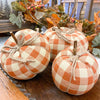 Three orange plaid pumpkins, a small, medium and large are available at Quilted Cabin Home Decor.