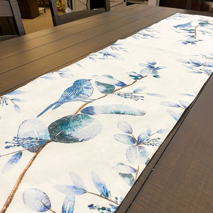 Bluebird Table Runner - 56" is available at Quilted Cabin Home Decor.