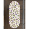 Floral-patterned oval runner on a wooden surface. Violet Meadow Table Linen Collection - Three Styles available at Quilted Cabin Home Decor.
