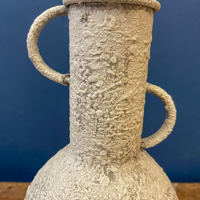 Textured ceramic vase with handles on a blue background. Rustic Metal Vases - Two Colours available at Quilted Cabin Home Decor.