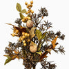 Dried autumn foliage arrangement featuring clusters of small golden-yellow berries, brown and tan leaves, and dark spiky stems on a plain white background.  Available at Quilted Cabin in Airdrie