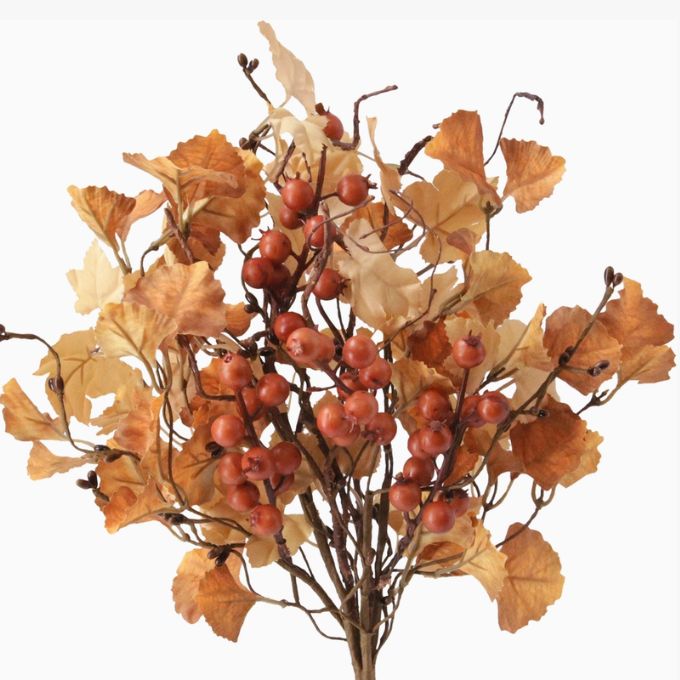 Autumn artificial floral branch with brown branches, warm orange and beige leaves, and clusters of small reddish-brown berries on a white background.  Autumn florals available at Quilted Cabin in Airdrie