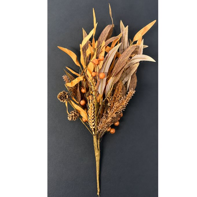 A dried autumn floral arrangement featuring golden-brown leaves, small orange berries, pinecones, and wheat-like stems, photographed against a dark charcoal background.  Available at Quilted Cabin in Airdire