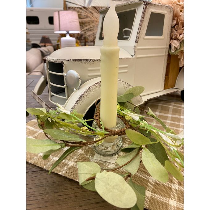 Mini green leaf candle ring shown with a candle holder and taper candle. available at quilted cabin home decor.