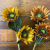 Four artificial sunflowers on a wooden surface. Sunflower Sprays - Two Colours available at Quilted Cabin Home Decor.