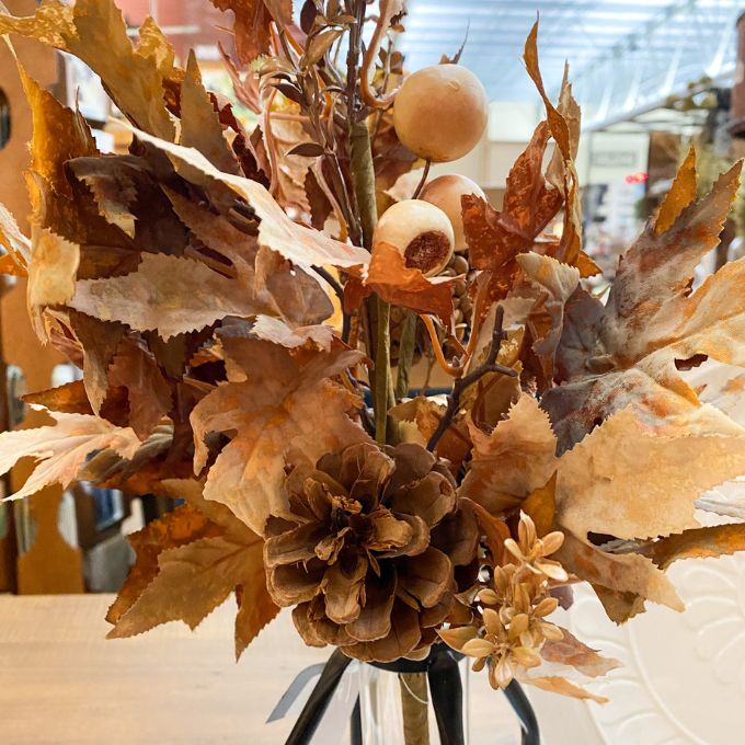 Autumn-themed floral arrangement with dried leaves and pinecones in a vase. Earthy Maple Floral Spray available at Quilted Cabin Home Decor.